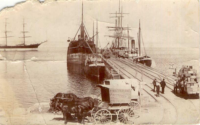 Port and harbour scene showing jetty and shipping