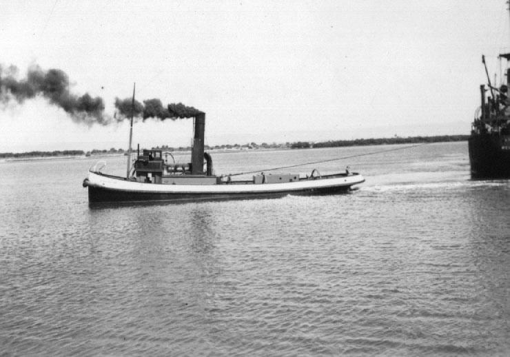 This image shows vessel trying to free Steamer "Allara" after she ran aground, 10/1/1938.