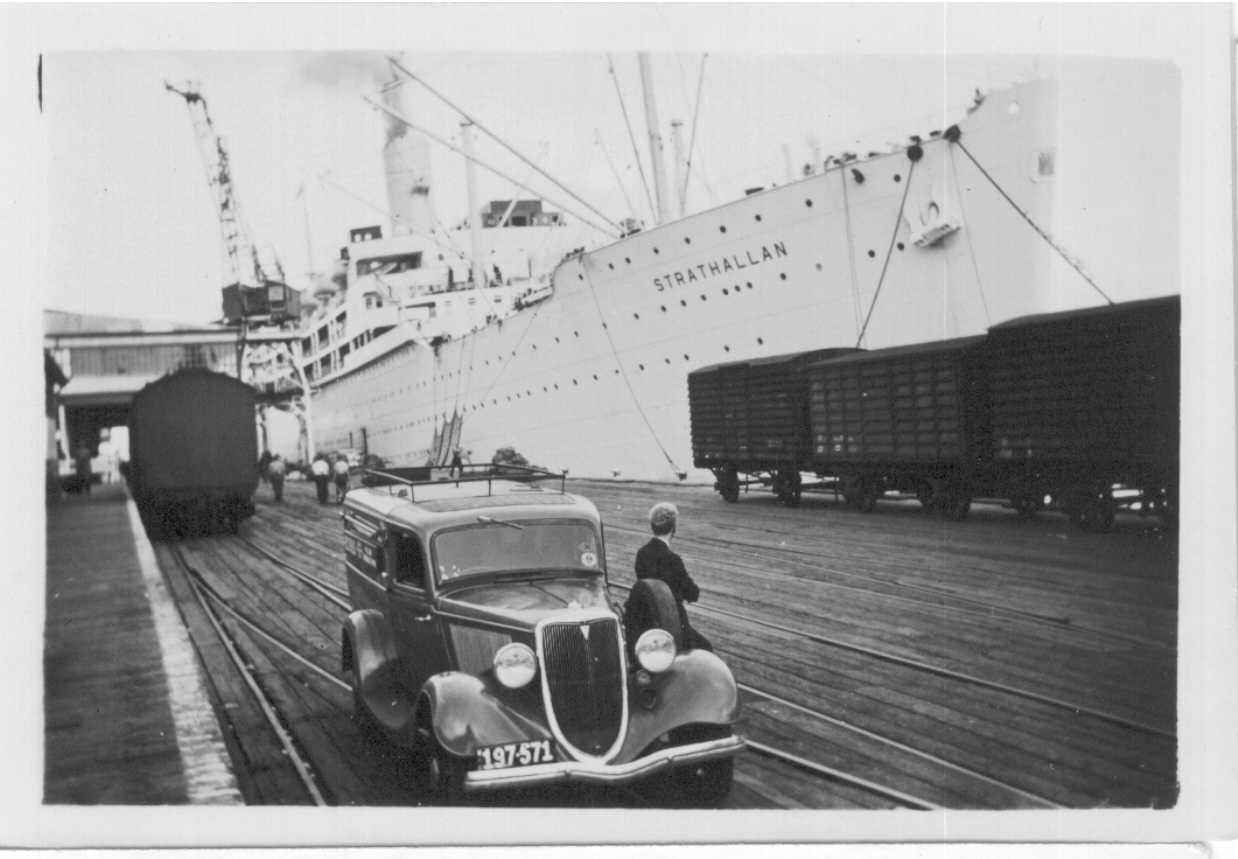 1938 passenger vessel.
This image shows vessel at a wharf with old car in foreground.