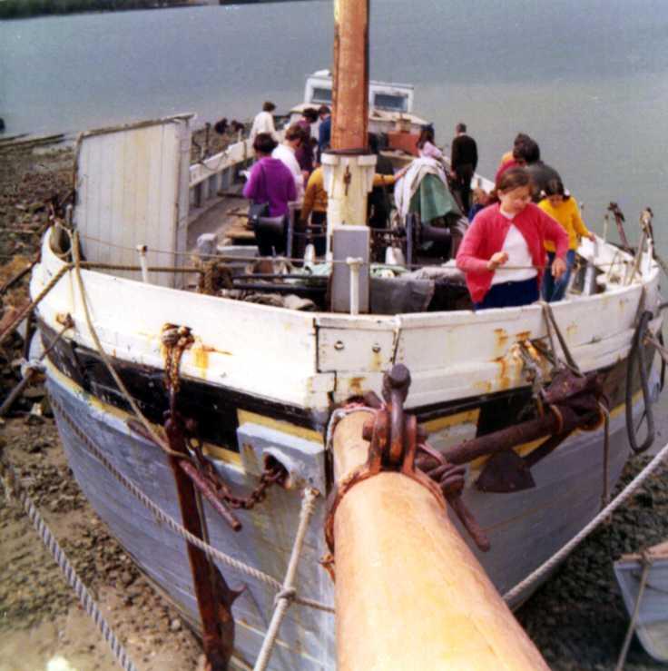 This image shows the bow of vessel, on land, in a state of disrepair.