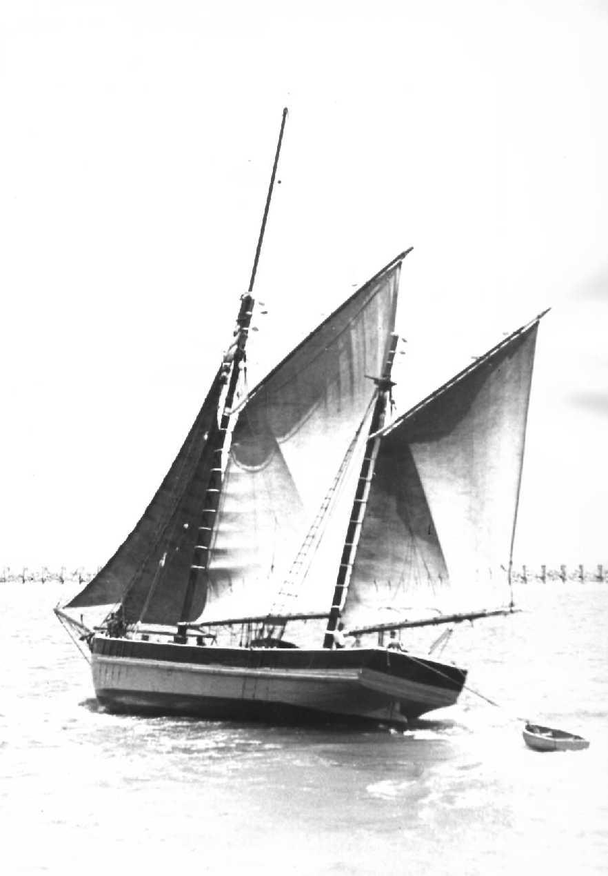 ADONIS Ketch built in 1864 in Franklin, Tasmania.
This image shows vessel in full, with a lifeboat floating behind.