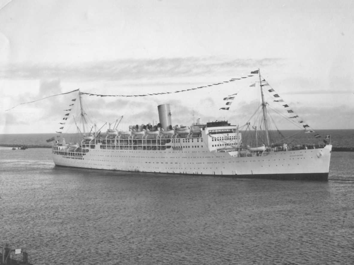 1931 passenger vessel.
This image shows vessel with flags flying, leaving for UK and breaking up, 15/5/1961.