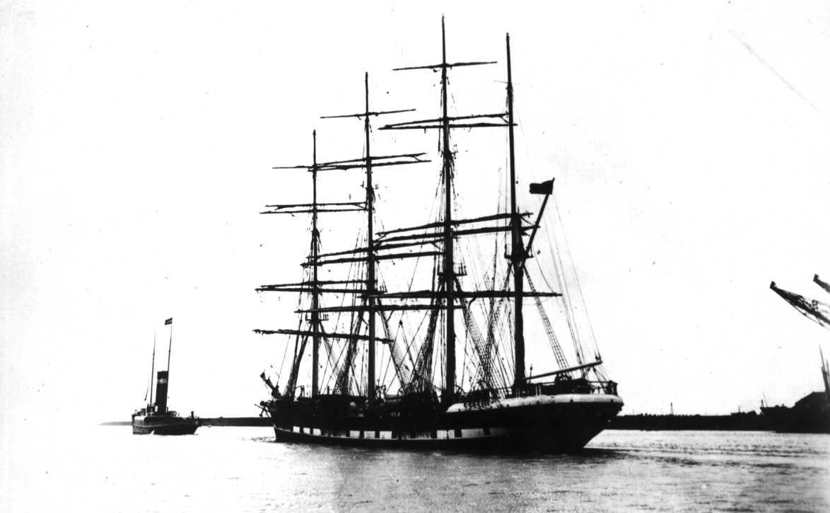 1882 barque, under tow.