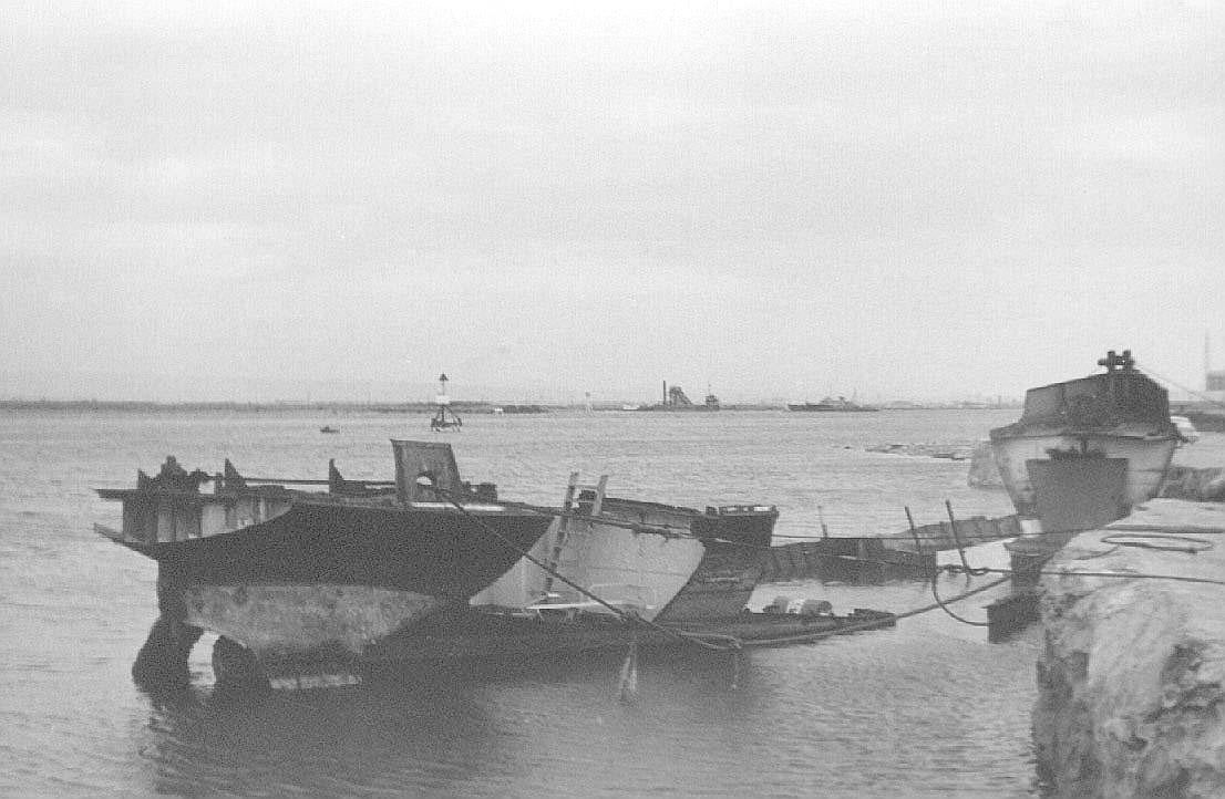 Tug being broken up near Osbourne