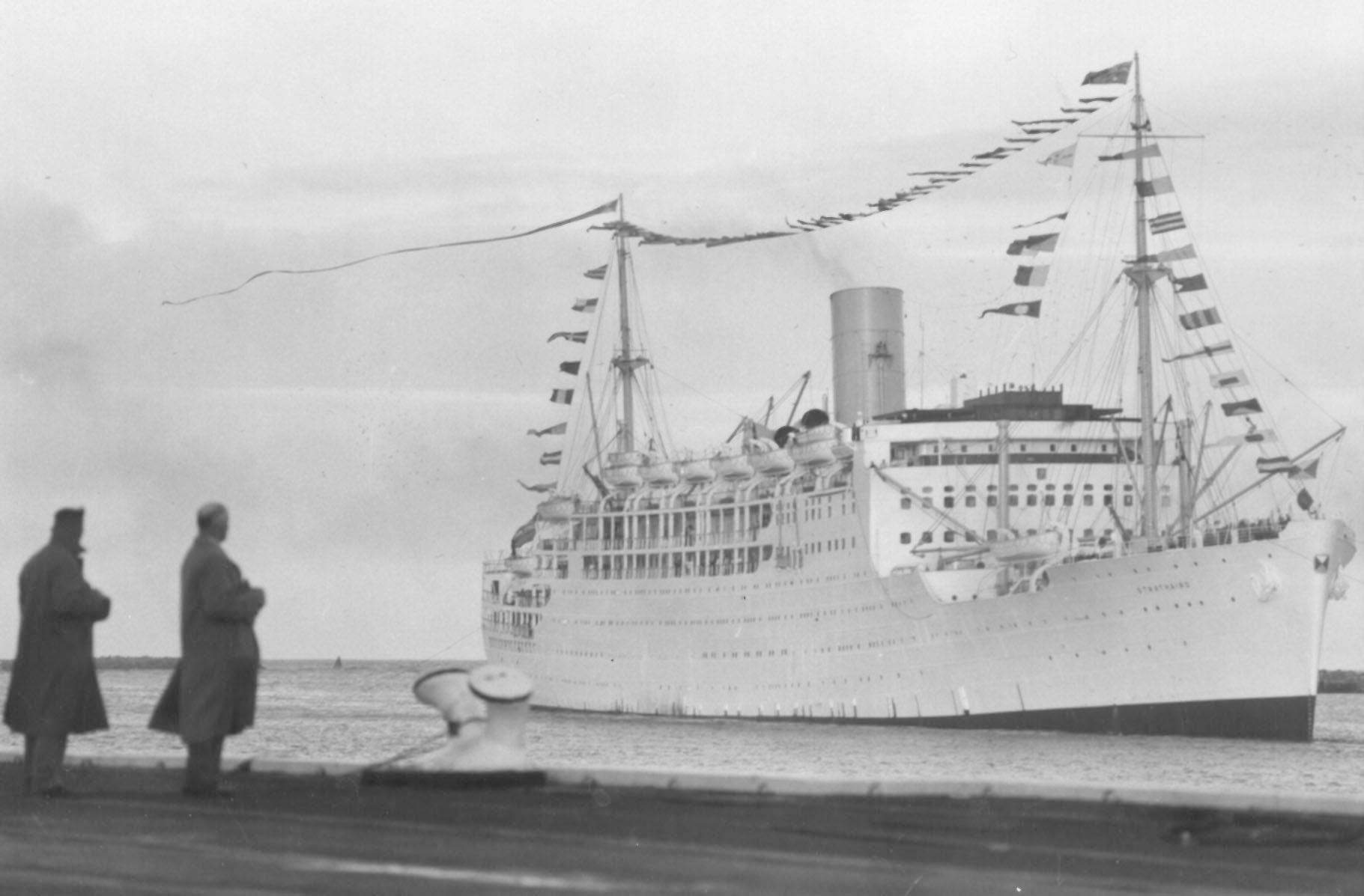 1931 passenger vessel.
This image shows vessel with flags flying, leaving for UK and breaking up, 15/5/1961.