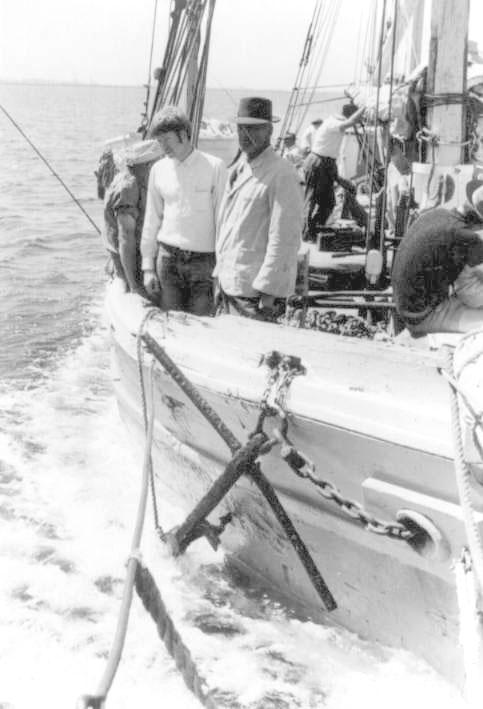 This image shows the vessel at Beehive Corner, Birkenhead.
This image shows side of vessel, at sea.  Man wearing hat is Capt R Harvey.