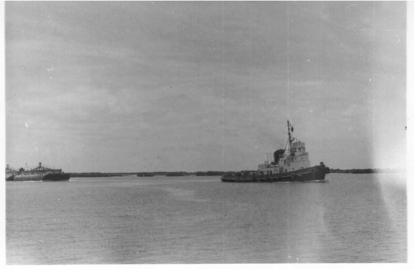 Tug towing pontoons