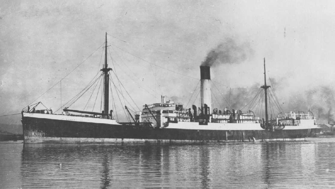 1912 general cargo vessel under tow.