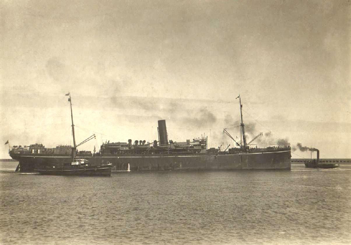 Image: large steamship with tug boats in water