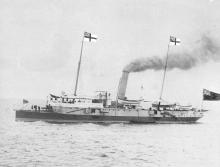 This small, heavily armed twin screw steel cruiser was built in 1883 at Newcastle-on-Tyne by William Armstrong & Co to the order of the South Australian Government.  She was commissioned on the 19th June 1884, (her captain was J.C.P. Walcot, RN) and was b