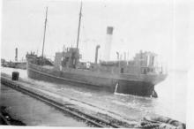 1903 general cargo vessel entering port