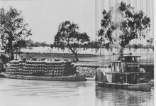 Paddle steamer and barge