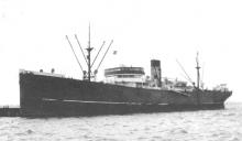 1931 general cargo vessel under tow.