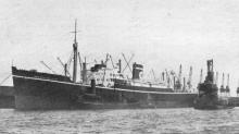 1935 refrigerated cargo vessel under tow.