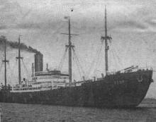 1929 General cargo vessel under tow