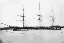 Image: three masted ship, sails furled