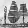 1876 Barque showing her 'hove to'.  Photographed from the ship's boat, a rare photograph of a ship under main skysail.