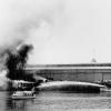 1942 Police Launch at Port Adelaide with fire on vessel in the background being extinguished by fireboat