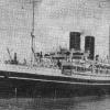 1905 passenger vessel under tow