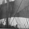 Showing sails and rigging.