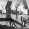 This image shows "Yelta" as a working tug, passing through the Birkenhead Bridge, Port Adelaide.