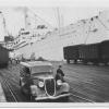 1938 passenger vessel.
This image shows vessel at a wharf with old car in foreground.