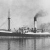 1912 general cargo vessel under tow.