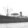 1931 general cargo vessel under tow.