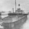 1854 passenger cargo vessel at a floating dock